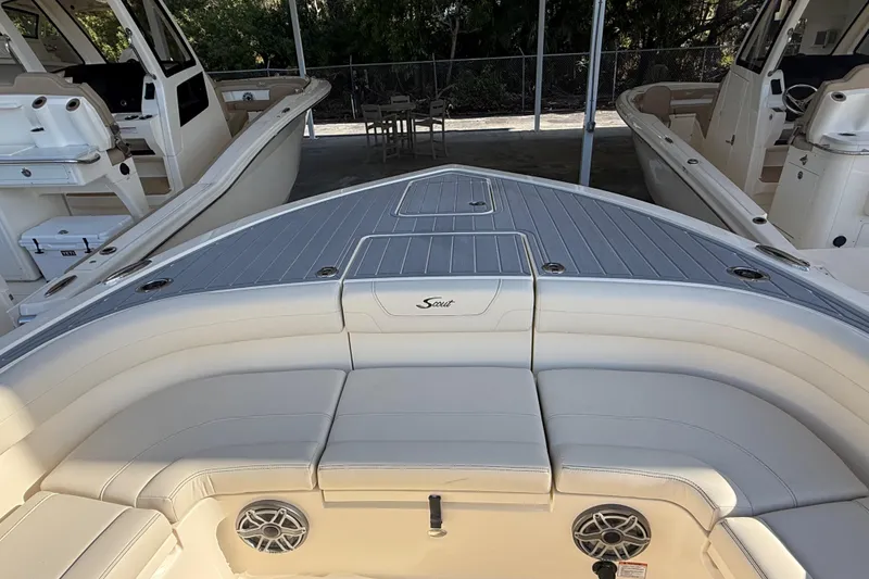 Slide: The Image of 2026 Scout 281 XSS boat interior with cushioned seating and sleek design. - 17