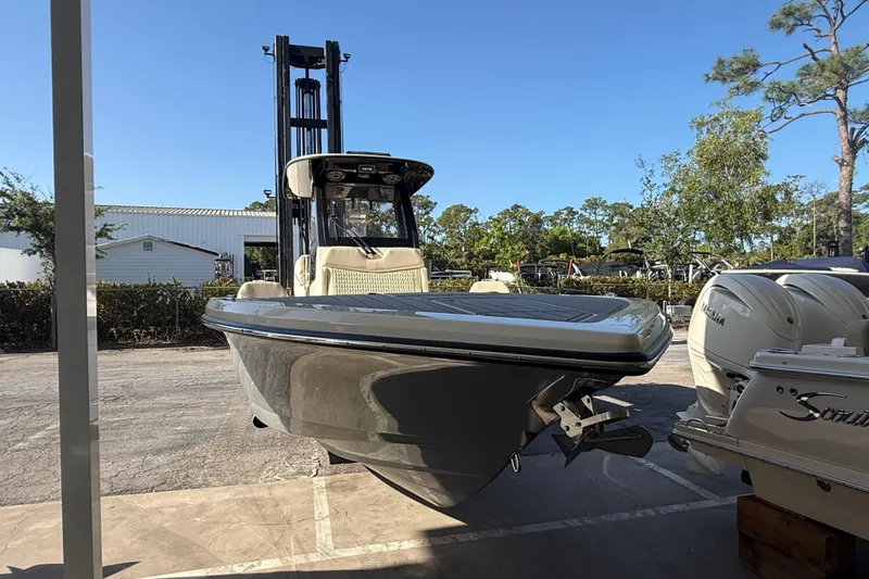 Slide: The Image of 2026 Scout 281 XSS boat displayed outdoors with Yamaha engines. - 5