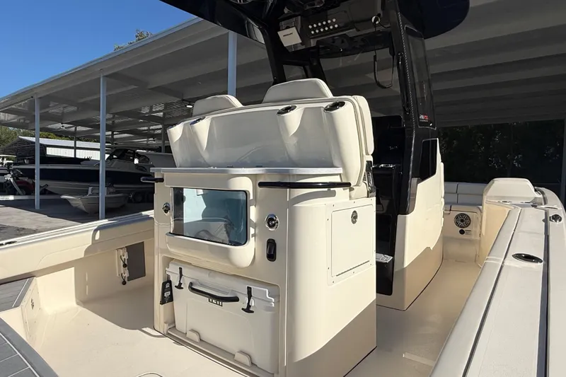 Slide: The Image of 2026 Scout 281 XSS boat interior with seating and storage compartments. - 8
