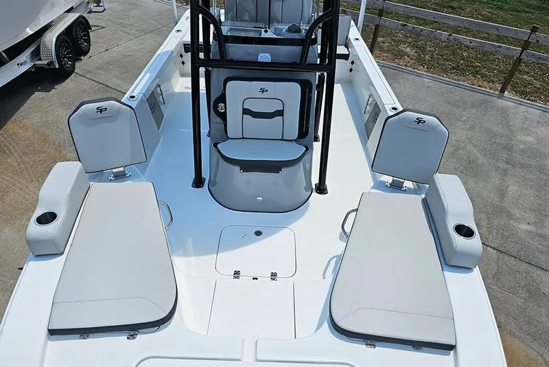 Slide: The Image of 2026 Sea Pro 230 Bay boat interior with seating and storage compartments. - 10
