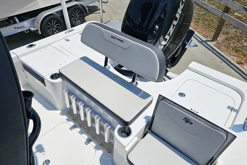 Slide: The Image of 2026 Sea Pro 230 Bay boat interior with seating and rod holders. - 12