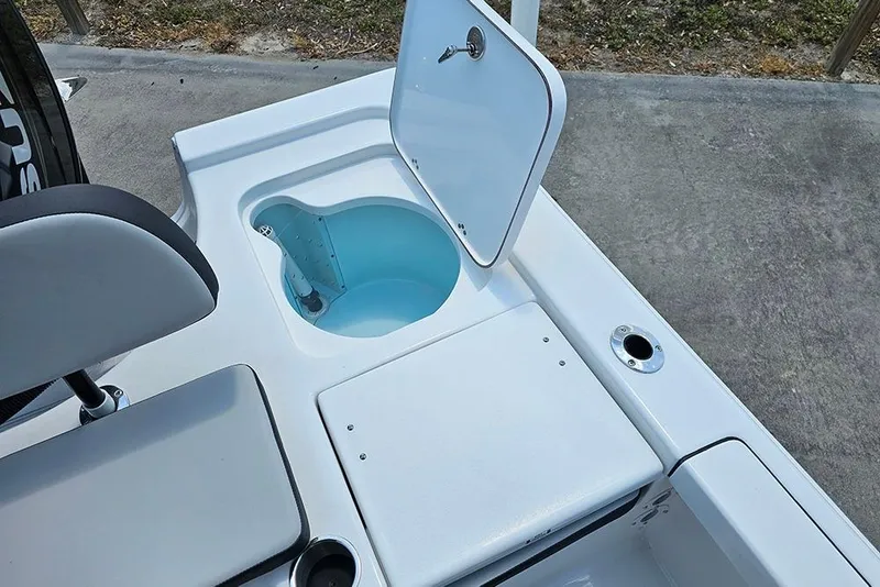Slide: The Image of Open storage compartment on a 2026 Sea Pro 230 Bay boat. - 13