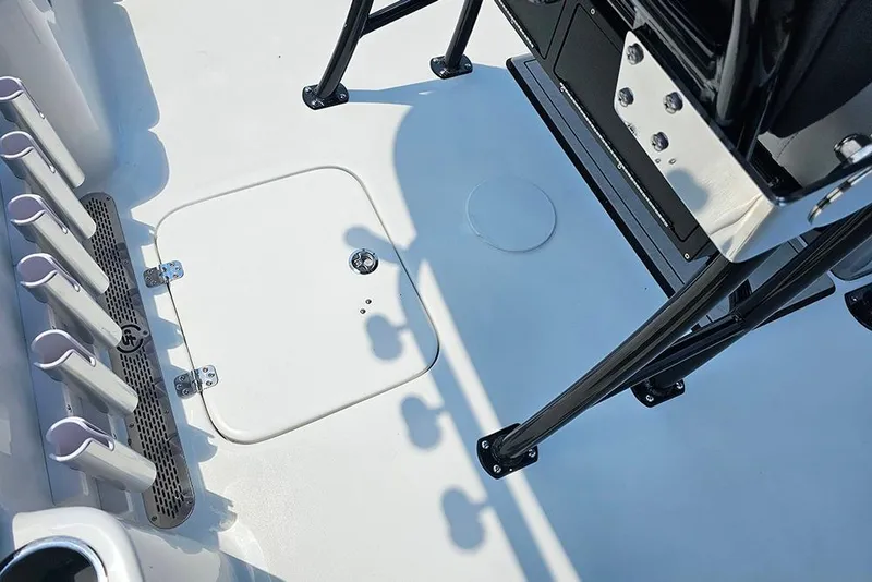Slide: The Image of Interior view of 2026 Sea Pro 230 Bay boat deck with rod holders. - 14