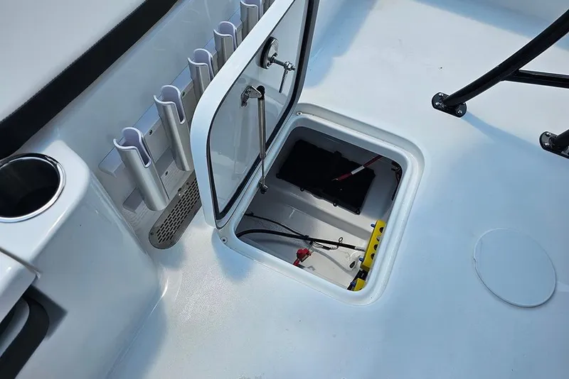 Slide: The Image of Open hatch on 2026 Sea Pro 230 Bay boat showing storage compartment and wiring. - 15