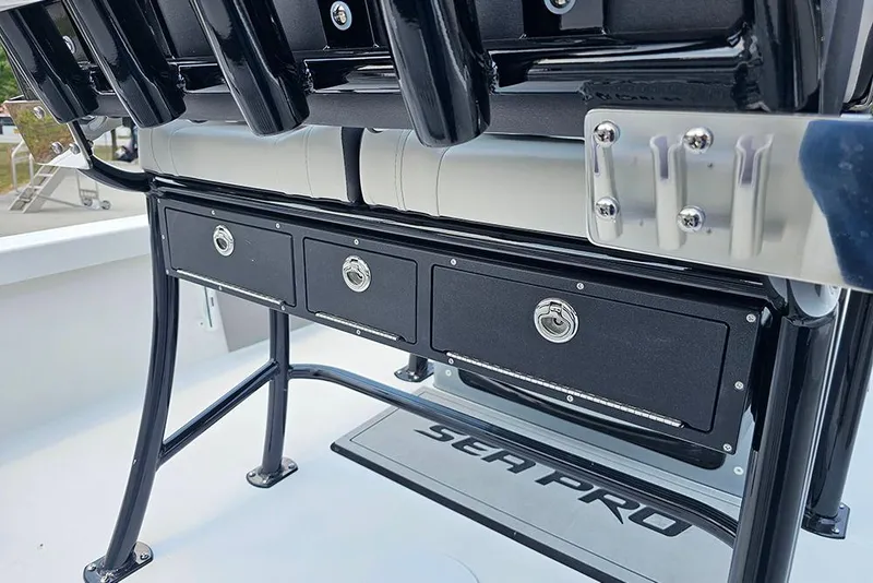 Slide: The Image of 2026 Sea Pro 230 Bay boat storage compartments and seating detail. - 16