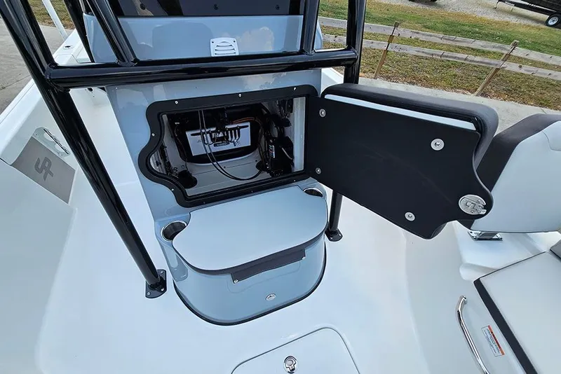 Slide: The Image of 2026 Sea Pro 230 Bay boat console with open storage compartment. - 20