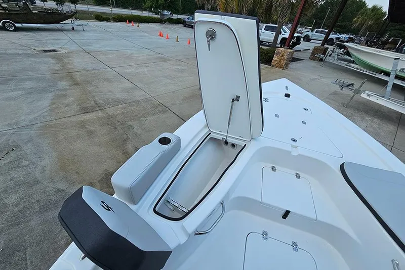 Slide: The Image of 2026 Sea Pro 230 Bay boat deck with open storage compartment and seating. - 21