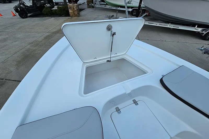 Slide: The Image of Open storage compartment on 2026 Sea Pro 230 Bay boat deck. - 24