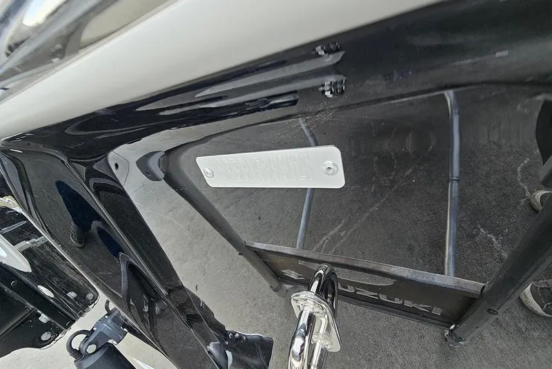 Slide: The Image of 2026 Sea Pro 230 Bay boat hull with identification plate and Suzuki engine. - 25