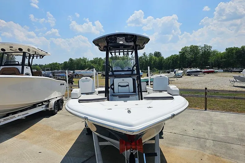 Slide: The Image of 2026 Sea Pro 230 Bay boat displayed outdoors under a sunny sky. - 4