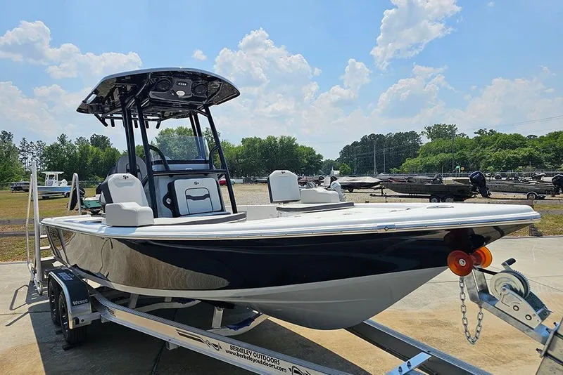 Slide: The Image of 2026 Sea Pro 230 Bay boat on trailer under clear sky. - 5