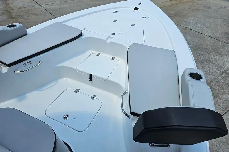 Slide: The Image of 2026 Sea Pro 230 Bay boat interior with seating and storage compartments. - 9