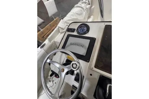Slide: The Image of 2001 Intrepid 322 Cuddy boat dashboard with Garmin navigation system. - 17