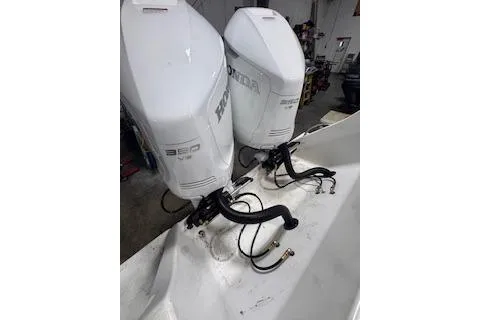 Slide: The Image of Twin Honda outboard motors on a 2001 Intrepid 322 Cuddy boat. - 18