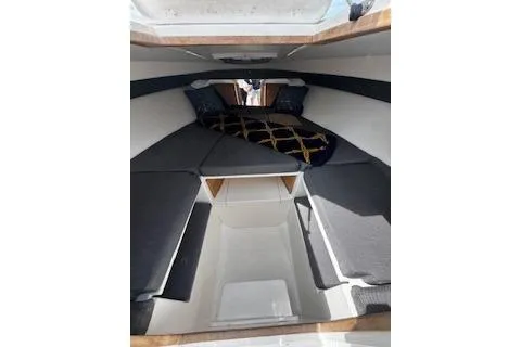Slide: The Image of Interior view of 2001 Intrepid 322 Cuddy cabin with cushions and storage space. - 3