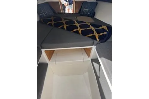 Slide: The Image of 2001 Intrepid 322 Cuddy cabin interior with bed and storage. - 4