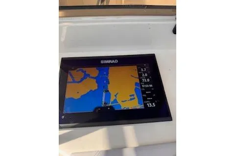 Slide: The Image of Simrad navigation display on 2001 Intrepid 322 Cuddy boat, showing nautical map and data. - 6
