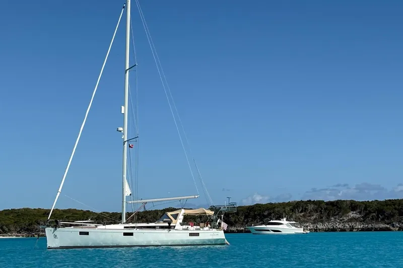 The Image of 2012 Beneteau Oceanis 48 sailboat on calm sea under clear blue sky. - 0