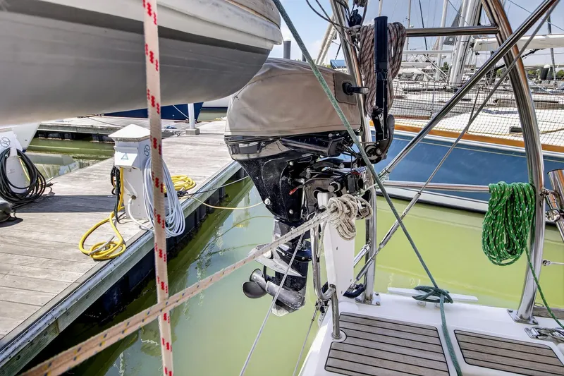 Slide: The Image of Beneteau Oceanis 48 sailboat, 2012 model, docked with outboard motor and ropes visible. - 18