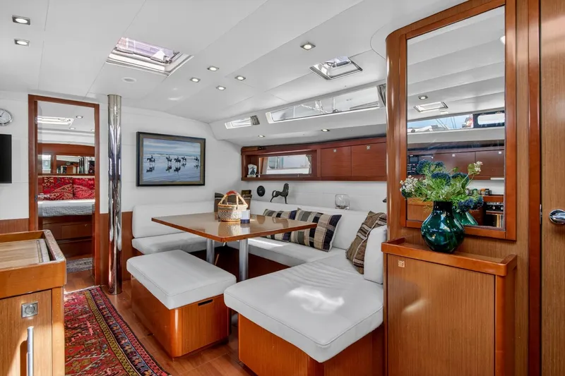 Slide: The Image of Luxurious interior of 2012 Beneteau Oceanis 48 yacht with elegant wood finishes and cozy seating. - 29