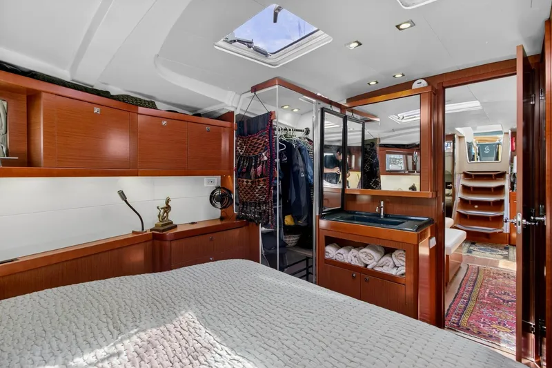 Slide: The Image of Luxurious interior of 2012 Beneteau Oceanis 48 yacht with wood finish and modern amenities. - 44