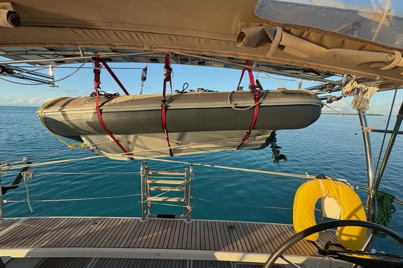 Slide: The Image of 2012 Beneteau Oceanis 48 sailboat docked at marina under clear blue sky. - 5