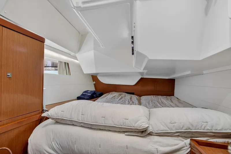 Slide: The Image of Cozy cabin interior of 2012 Beneteau Oceanis 48 sailboat with comfortable bedding. - 50