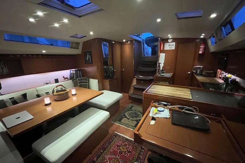 Slide: The Image of Beneteau Oceanis 48 sailboat, 2012 model, docked in Charleston, SC, with dual steering wheels. - 6