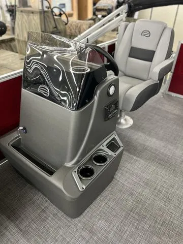 Slide: The Image of Interior of Sun Tracker Party Barge 16 DLX 2026 with helm console. - 6