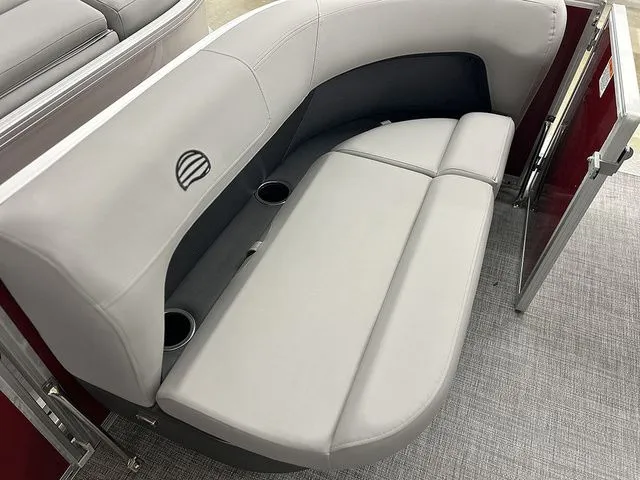 Slide: The Image of Sun Tracker Party Barge 16 DLX 2026 seating area with gray upholstery. - 8