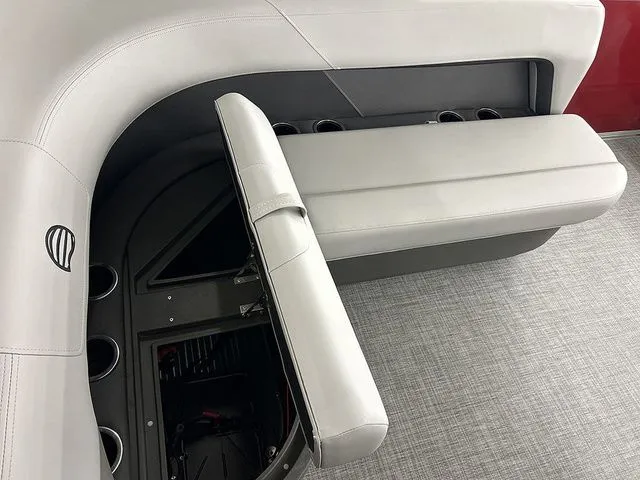 Slide: The Image of Interior of Sun Tracker Party Barge 16 DLX 2026 with seating and storage. - 9