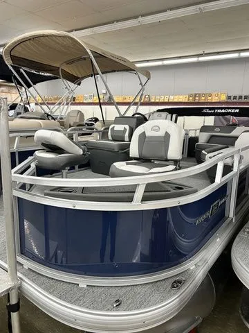 The Image of 2026 Sun Tracker Bass Buggy 18 DLX pontoon boat in showroom. - 1