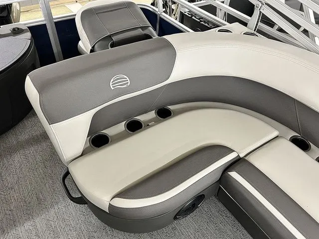 Slide: The Image of Interior of 2026 Sun Tracker Bass Buggy 18 DLX with gray and white seating. - 10