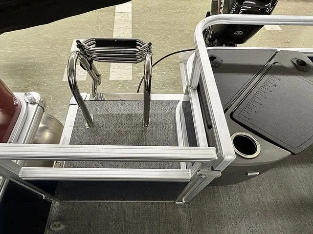 Slide: The Image of 2026 Sun Tracker Bass Buggy 18 DLX pontoon boat rear view. - 13