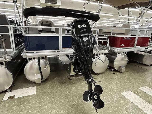 Slide: The Image of 2026 Sun Tracker Bass Buggy 18 DLX with outboard motor. - 14