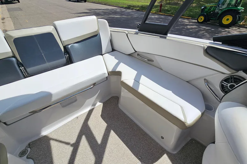 Slide: The Image of Interior of a 2014 Scarab 215 boat with white and gray seating. - 10