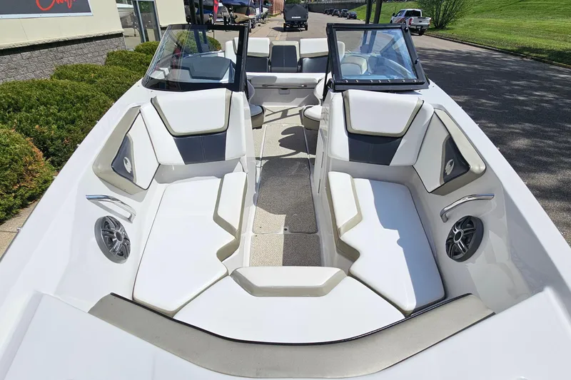 Slide: The Image of 2014 Scarab 215 boat interior with white seating and modern design. - 17