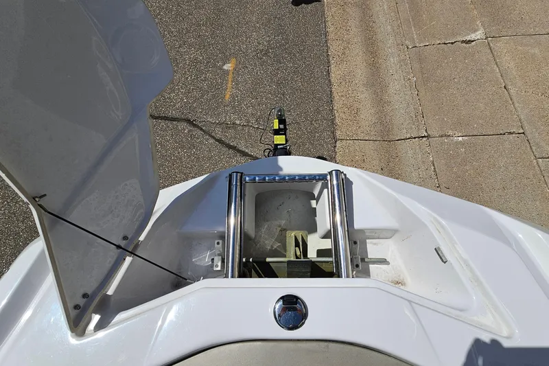 Slide: The Image of Open hatch of a 2014 Scarab 215 boat, showing interior compartment and metal fittings. - 20