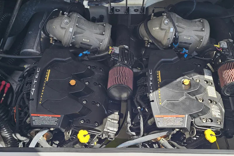 Slide: The Image of 2014 Scarab 215 engine compartment with dual 4-TEC supercharged engines. - 24