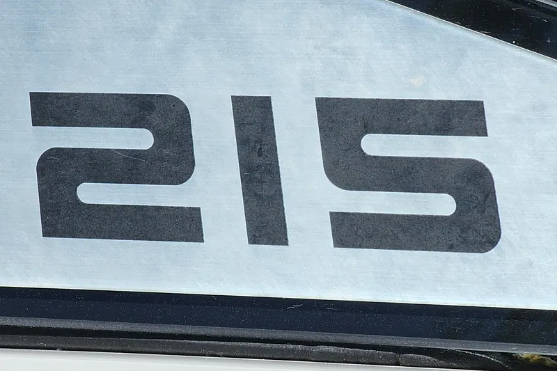 Slide: The Image of Scarab 215 model number displayed on a 2014 boat exterior. - 27