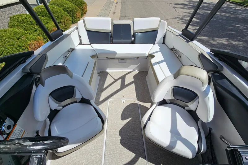 Slide: The Image of 2014 Scarab 215 boat interior with white seating and modern design. - 8