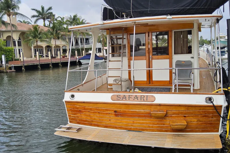 Slide: The Image of 1997 Grand Banks 46 Europa yacht docked near waterfront homes. - 29