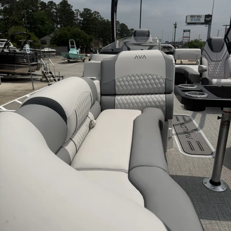 Slide: The Image of Luxurious seating in Avalon QLS25T Excalibur 2026 boat. - 17