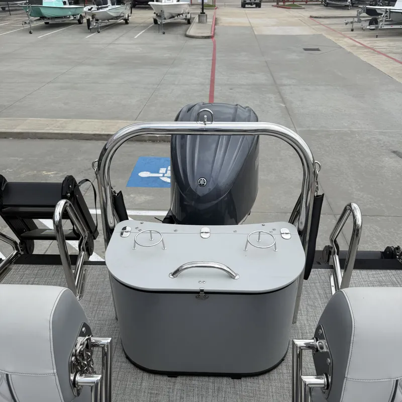 Slide: The Image of 2026 Avalon QLS25T Excalibur boat with motor in parking lot. - 30