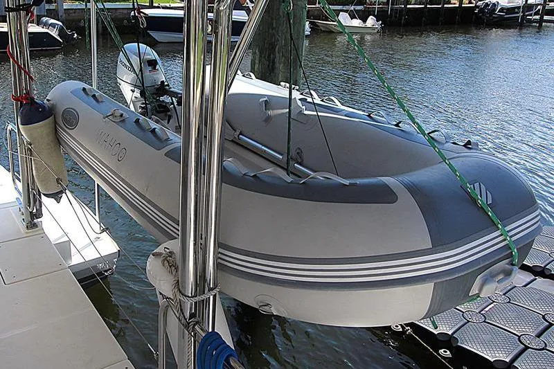 Slide: The Image of Inflatable dinghy on Leopard 50 yacht, docked by the water, 2020 model. - 11