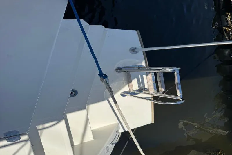 Slide: The Image of Stern view of 2020 Leopard 50 yacht with ladder and mooring lines. - 13