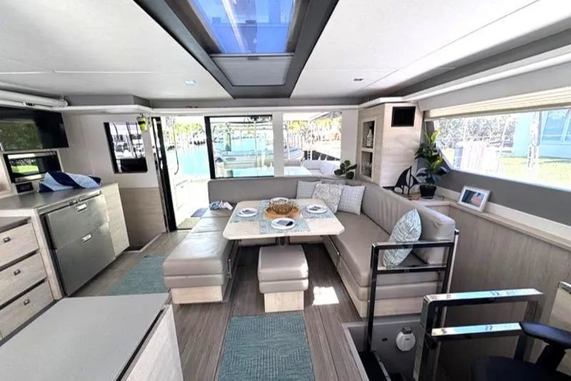 Slide: The Image of Luxurious interior of a 2020 Leopard 50 yacht with modern dining area and skylight. - 14