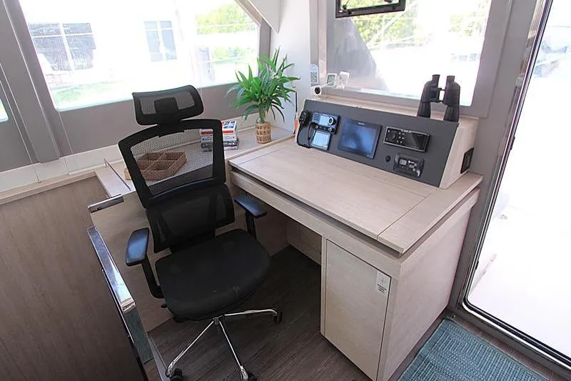 Slide: The Image of Modern yacht interior with navigation desk, ergonomic chair, and plant; Leopard 50, 2020 model. - 17