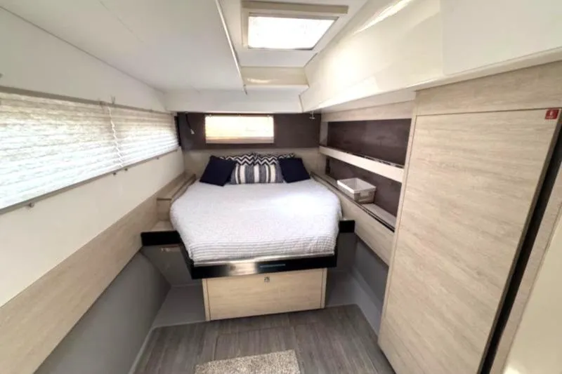 Slide: The Image of Luxurious interior of a 2020 Leopard 50 yacht with a cozy bedroom setup. - 19