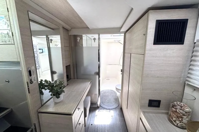 Slide: The Image of Modern interior of a 2020 Leopard 50 yacht with bathroom and vanity area. - 20
